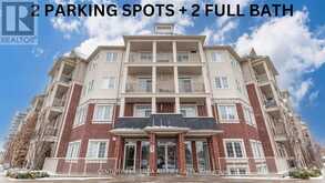 211 - 84 ASPEN SPRINGS DRIVE | Clarington Ontario | Slide Image One