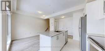 32 - 165 TAPSCOTT ROAD | Toronto Ontario | Slide Image Ten