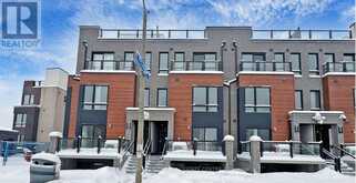 32 - 165 TAPSCOTT ROAD | Toronto Ontario | Slide Image One