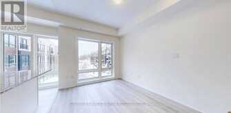 32 - 165 TAPSCOTT ROAD | Toronto Ontario | Slide Image Three