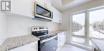 32 - 165 TAPSCOTT ROAD | Toronto Ontario | Slide Image Six