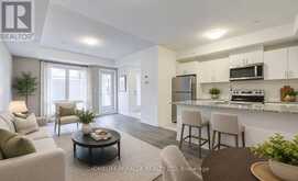 8 - 145 TAPSCOTT ROAD | Toronto Ontario | Slide Image Two