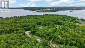 LOT 40 WHISPERING PINE CIRCLE | Tiny Ontario | Slide Image One