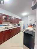 303 - 2050 BRIDLETOWNE CIRCLE | Toronto Ontario | Slide Image Five