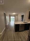 405 - 128 GROVEWOOD COMMON | Oakville Ontario | Slide Image Two