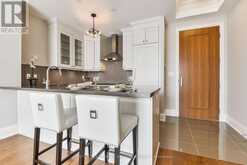 210 - 9 STOLLERY POND CRESCENT | Markham Ontario | Slide Image Three
